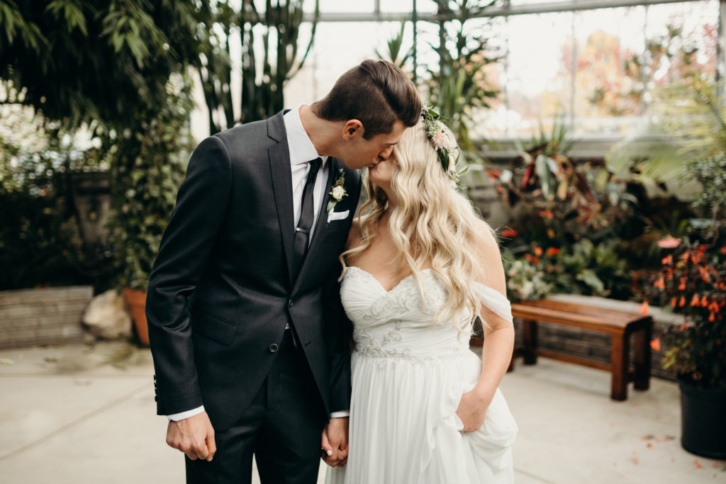 bride and groom kiss wedding at civic gardens in london, ontario